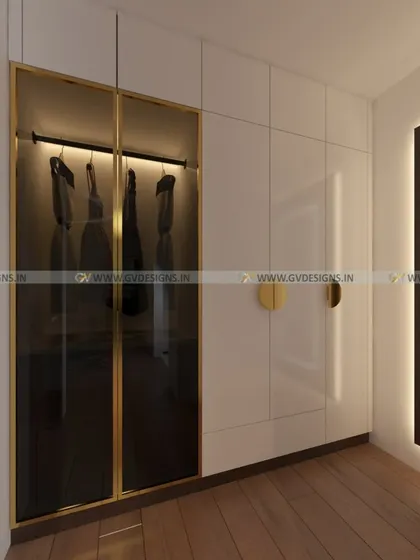 This ultimate floor-to-ceiling wardrobe features swing shutters, a loft, and a bottom drawer for maximum storage. The design includes a section with a gold finish aluminum frame and black tinted glass, adding a touch of modern luxury.