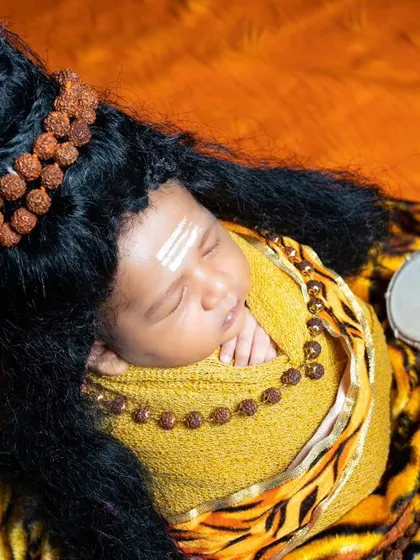 Another peaceful shot of our little Shiva, capturing the divine innocence of a newborn.