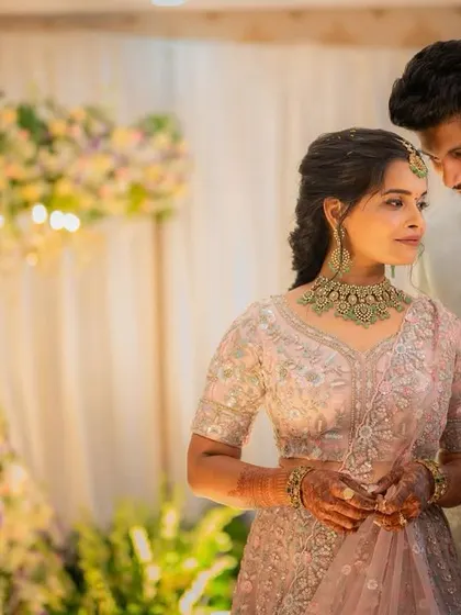 A more artistic shot of the couple. The lighting highlights the soft texture of her hair and the glow of her skin.