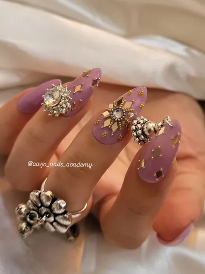 This view highlights the different charms and embellishments used in this Navratri set, including the dangling jhumka and the sparkling star-shaped crystals.
