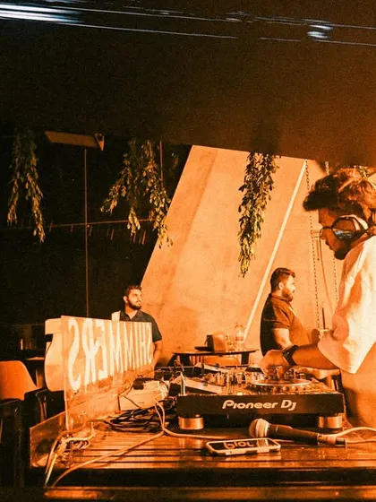 A candid shot from a set at Shimmers. The orange lighting and hanging plants created a cool, jungle-like vibe.