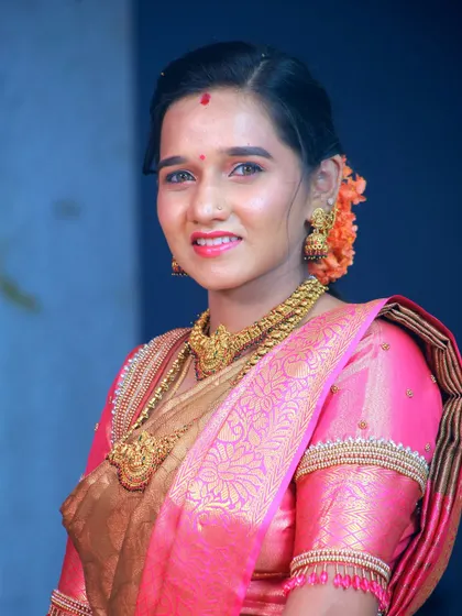 A classic portrait from a family function, showcasing the beautiful traditional attire and gold jewelry. I ensure everyone gets a stunning photo to remember the occasion.