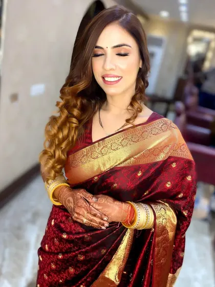 A classic festive look for a client in a beautiful red silk saree. I created a golden shimmery eye and a flawless base to match the traditional attire.