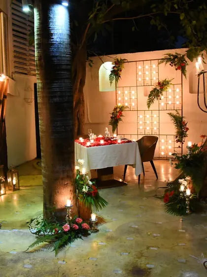 An intimate corner of our restaurant decorated for a very special romantic dinner. We use candles and flowers to create a truly magical and private setting.