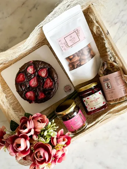 A look inside our customizable Vegan Hamper. This one features a strawberry chocolate cake, granola, strawberry jam, and flavored nuts, all completely plant-based.