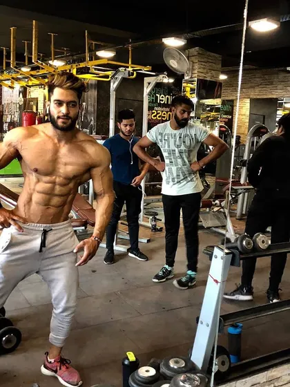 Surrounded by iron, this is where I feel most alive. This photo captures the results of a disciplined lifestyle in a typical gym setting.