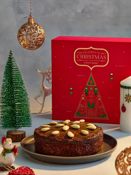 A festive Christmas scene created for a Marriott Bonvoy campaign. The warm lighting, classic holiday props, and delicious almond cake come together to evoke the cozy feeling of the holiday season.