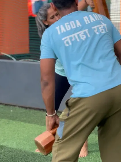 A close-up of the "Tagda Raho" motto during a training session. It's a reminder of our goal: to build resilient, strong bodies for golf and for life.