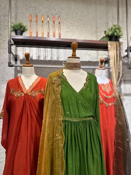 Another view of the earthy-toned festive collection. The wrap-style kurta in olive green is a particularly flattering and modern silhouette.