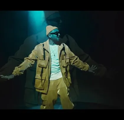 A full shot of Benny Dayal, showcasing the complete styled look for the BGMI music video. The shadow effect adds a cool, graphic element to the image.