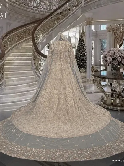 A full view of the tail gown with its astonishing tail veil, perfect for making a statement on your special day.