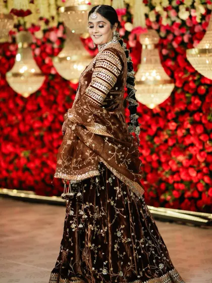 This beautiful client is giving off royal vibes in her brown velvet outfit. I created a glamorous look with defined eyes and a braided hairstyle to match her regal attire.