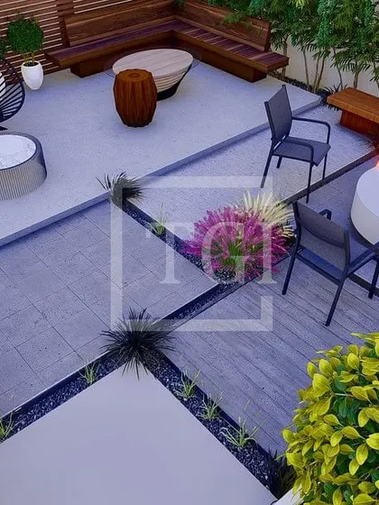 An overhead view of a seating area in the Noida project, designed around a central fire pit with a mix of built-in benches and modern chairs.