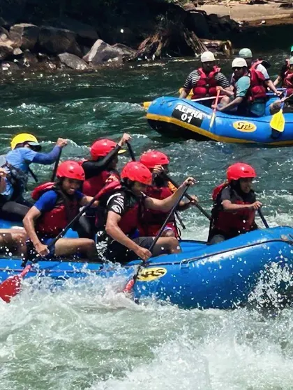 Two rafts navigate the rapids side-by-side during a summer camp course at Dandeli. It’s a great way for kids to build confidence and teamwork skills.
