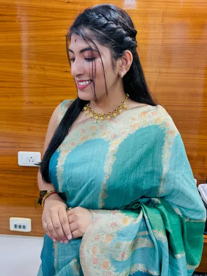 Another angle of this soft and pretty non-bridal look. The makeup enhances her features beautifully without feeling overdone, making it perfect for any celebration.