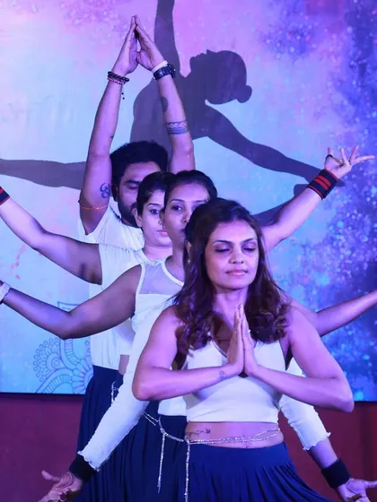The grand finale of our group performance. The energy and synchronization on stage were a beautiful testament to our journey as a yoga family.