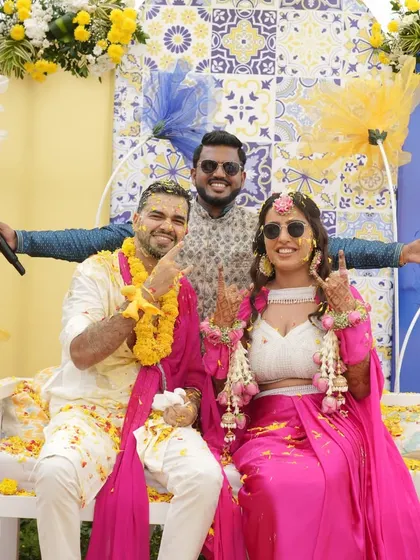 A fun group photo with the couple after they've been covered in haldi. These are the joyful, messy, and memorable moments I love to create.