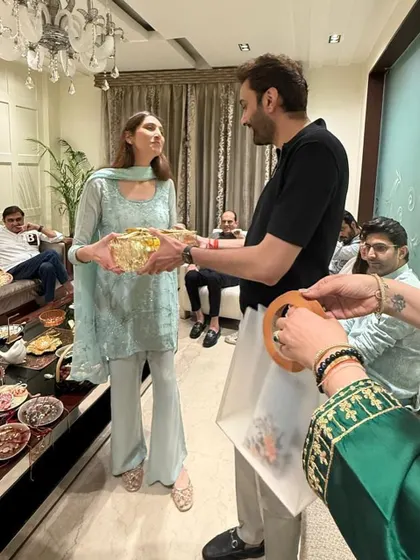 A beautiful moment of a sister gifting a brother one of my curated hampers during Raksha Bandhan.