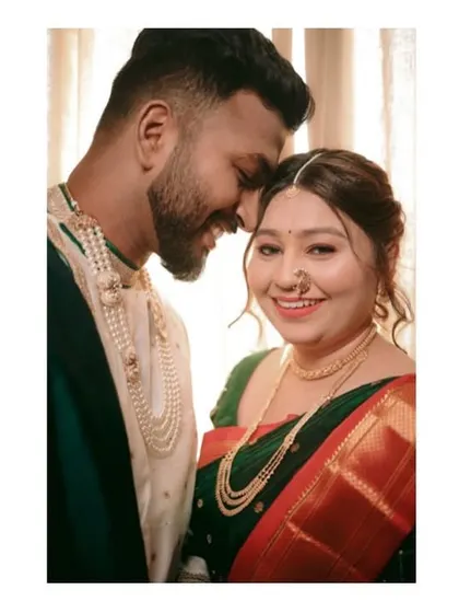 A happy, close-up portrait of the couple, capturing their smiles and the joy of their wedding day.