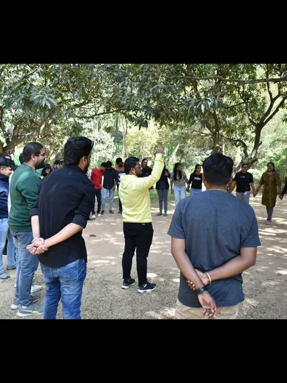 Leading a group in a circle, fostering communication and collaboration. These foundational activities are crucial for effective team building.