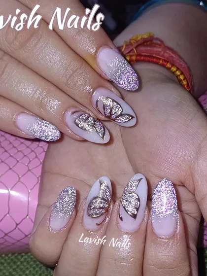 This elegant design features a soft pink base with silver glitter accents and beautifully detailed butterfly wing art for a touch of whimsy.