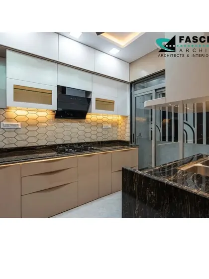 This kitchen at Lodha Belair features beige cabinets with profile handles and a hexagonal tile backsplash. The design is both modern and warm, creating a welcoming cooking space.