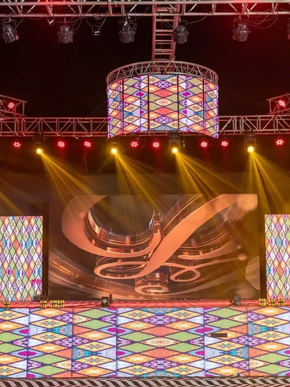 A grand Sangeet stage with a full truss setup and dynamic LED screens. I work with top technical teams to create concert-level experiences for your celebration.