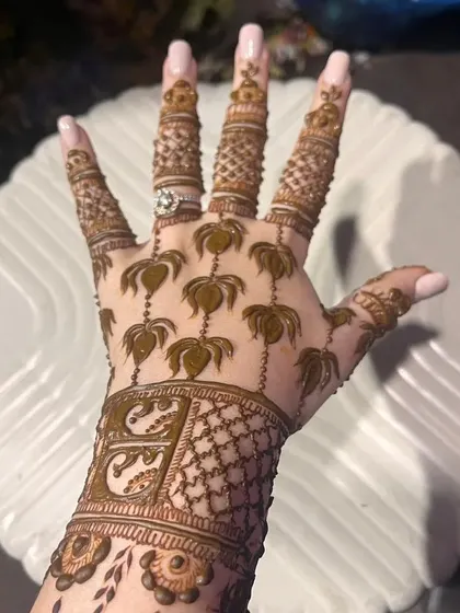 The back of the hand for the 3D lotus design, featuring delicate palm tree motifs and personalized initials on the wristband.
