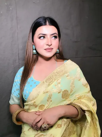 Feeling beautiful in this lovely yellow and blue saree. The makeup is soft and elegant, with defined eyes and a neutral lip to complement the outfit.