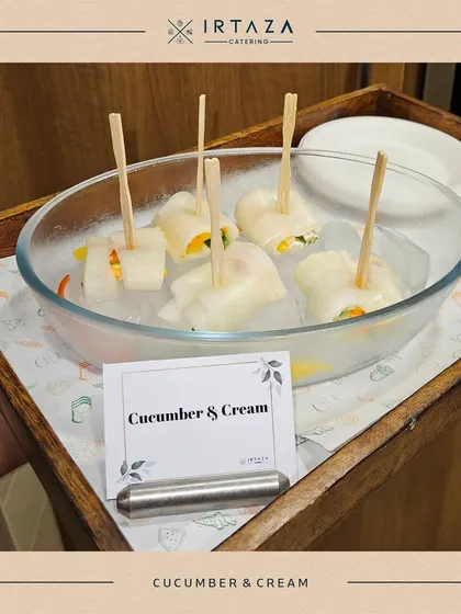 A refreshing appetizer of Cucumber & Cream rolls. Thin slices of cucumber are wrapped around a creamy filling, offering a light and crisp bite that's perfect for any occasion.