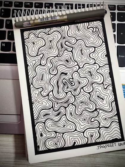 A hand-drawn abstract pattern of chaotic, swirling lines contained within a neat border. This piece is about finding order within chaos and the beauty that can emerge from a wandering mind and a steady hand.