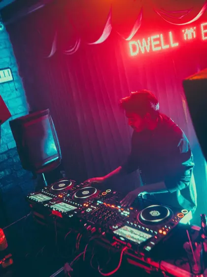 A shot of me playing for the Bangalore Massive crew, one of my favorite gigs in the city. The neon sign and moody lighting perfectly match the drum and bass vibes of the night.