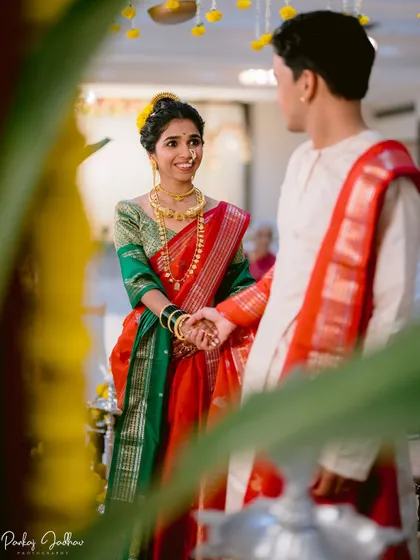 A beautifully framed shot of the bride looking at her groom during the ceremony.