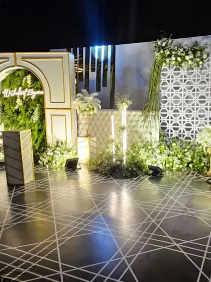 Another angle of the stunning '40 Shades of Elegance' stage, showing the interplay of light and shadow on the geometric floor and textured backdrops.