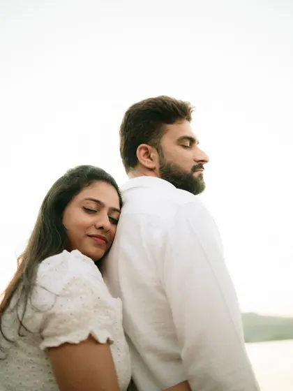 A quiet moment of connection, with the bride resting on the groom's back, showcasing trust and comfort.