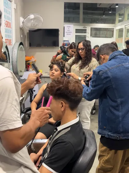 A behind-the-scenes look at a portfolio shoot, with students, models, and photographers all working together to get the perfect shot.