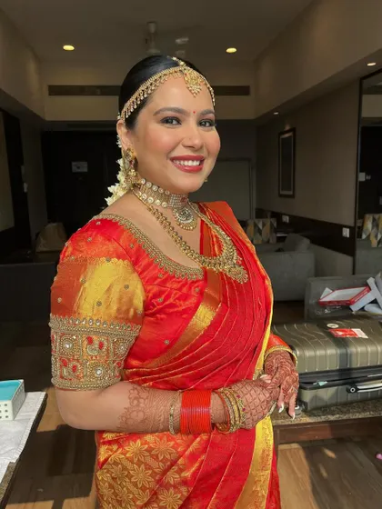 The bride's joyful smile is the best accessory. The makeup is designed to make her feel confident and beautiful on her special day.