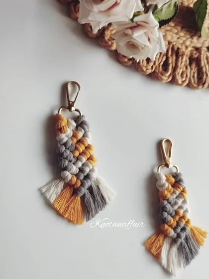 Pretty little macrame keychains in a pastel combination of yellow, grey, and white. These are a unique and affordable gift for friends or family.