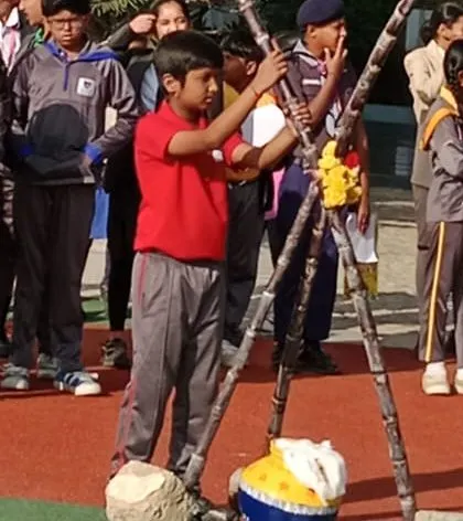 Students participate in the traditional Pongal pot ceremony, learning about the cultural significance of the harvest festival.