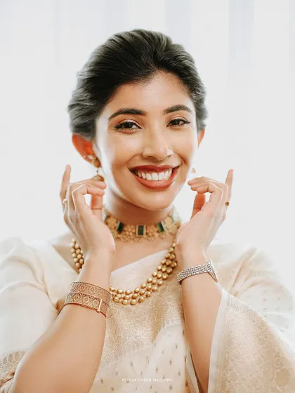 A close-up of the bride's happy and radiant smile, a perfect capture of her wedding day glow.