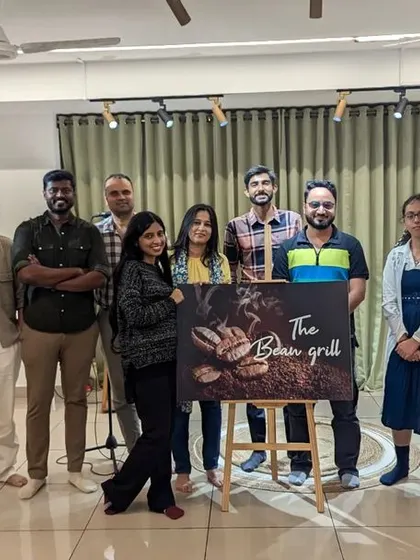 The community that creates together. A group photo after a fantastic "The Bean Grill" open mic, celebrating a night of wonderful performances and new friendships.