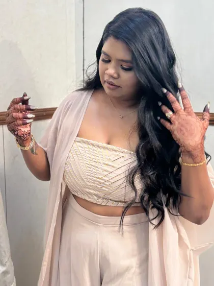 A candid shot of a client with her beautiful party mehndi, looking absolutely radiant.