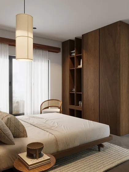 A minimalist bedroom with a focus on natural wood. The design includes a platform bed and a custom floor-to-ceiling wardrobe with integrated open shelving.