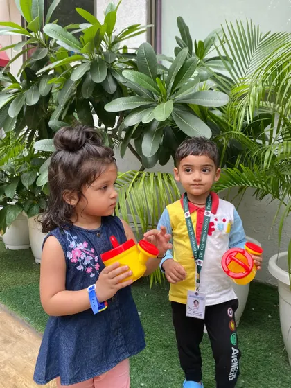 Our little eco-warriors from the Red Caterpillar class learning to care for nature. Watering plants helps them develop respect for the environment and empathy for living things.