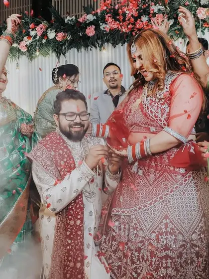 Another angle of the dramatic ring exchange, capturing the excitement from the guests' perspective.