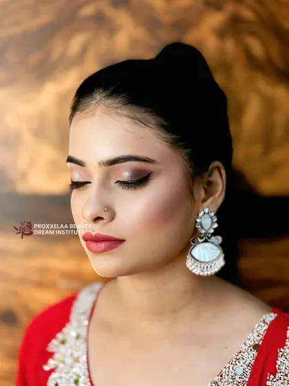 Serving all the glam with this stunning Indian party makeup. The look features a soft smokey eye, flawless skin, and a beautiful red lip, perfect for any festive occasion.
