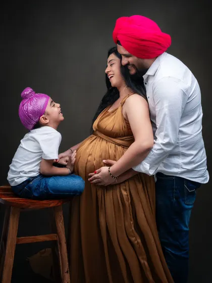 In the warmth of family love, every little smile and gentle touch tells a story. This precious family of three, soon to be four, radiated pure joy.