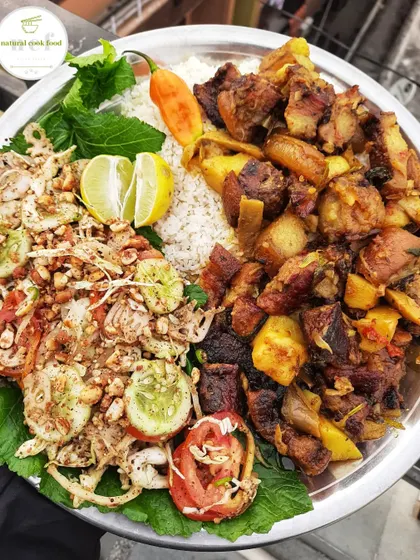 A beautiful plate of smoked pork served with a fresh and tangy salad.