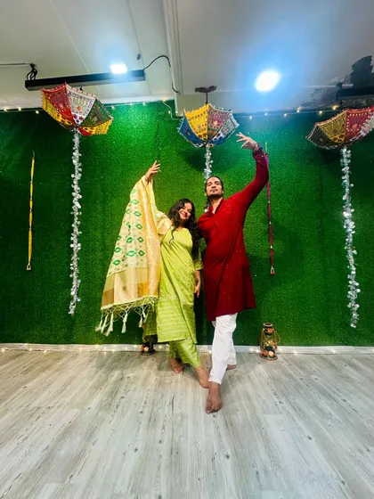 Another festive pose in front of our decorated studio wall during the Diwali party.