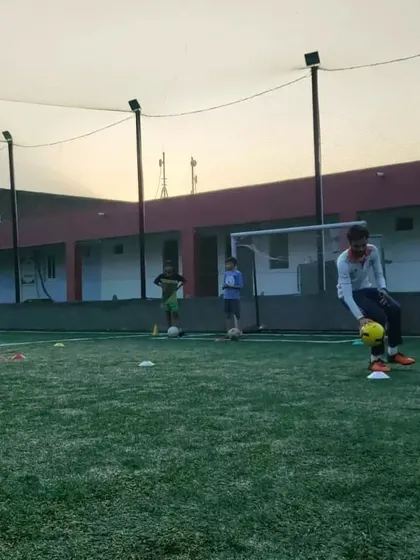 A player practices his ball handling during a free camp. These sessions are designed to introduce fundamental skills in an engaging way for newcomers.